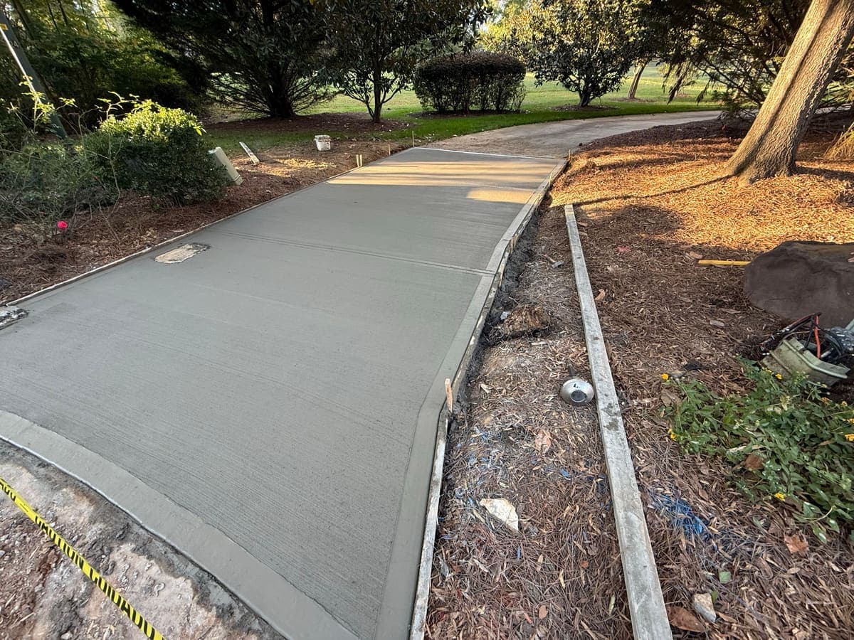 Local Concrete Contractor Concrete Driveway Aprons project in Gastonia, North Carolina (Gaston County) — 4000 PSI commercial-grade concrete, expansion joints, professional broom or smooth finish.
