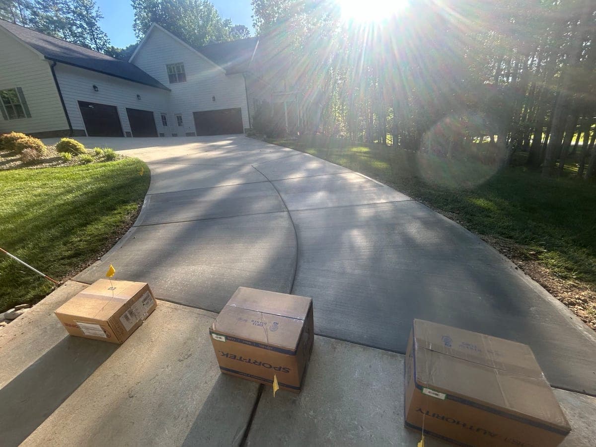 Newly poured Concrete Driveway Repair in Gastonia, NC (Gaston County) by Local Concrete Contractor — 4000 PSI mix, double-mat #4 rebar, broom-finish surface, 28-day full cure.