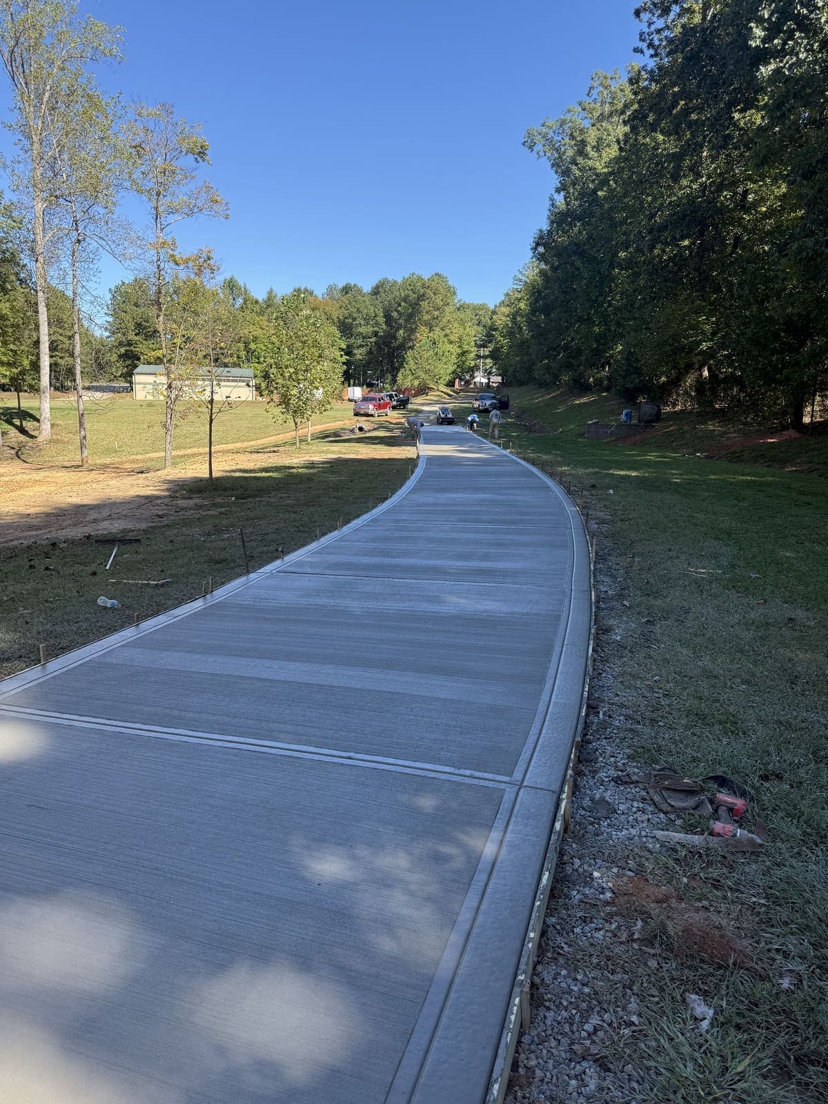 Local Concrete Contractor Long Concrete Driveways project in Gastonia, North Carolina (Gaston County) — 4000 PSI commercial-grade concrete, expansion joints, professional broom or smooth finish.