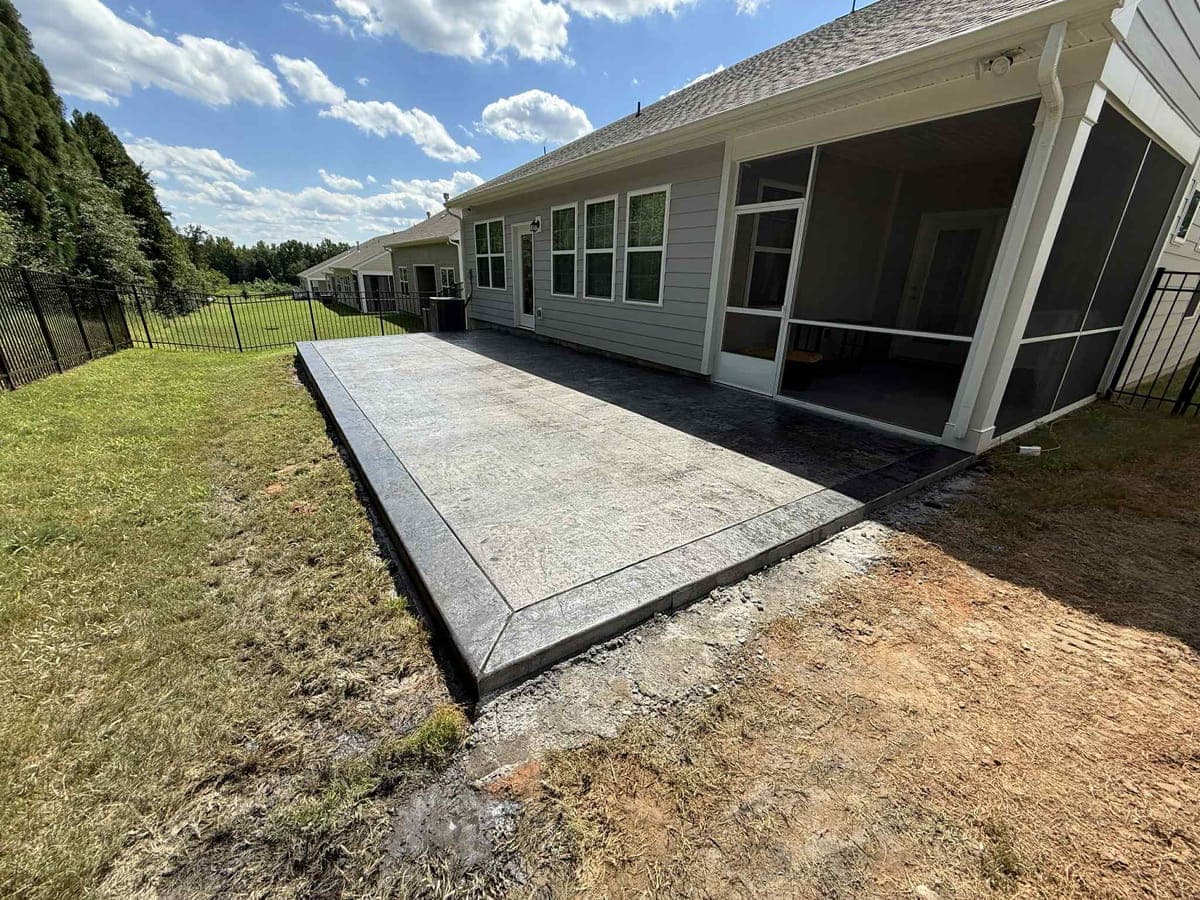 Professional Stamped Concrete Patios installation in Mooresville, North Carolina by Local Concrete Contractor — commercial-grade base prep, 6-inch compacted aggregate, expansion joints sawn within 12 hours.